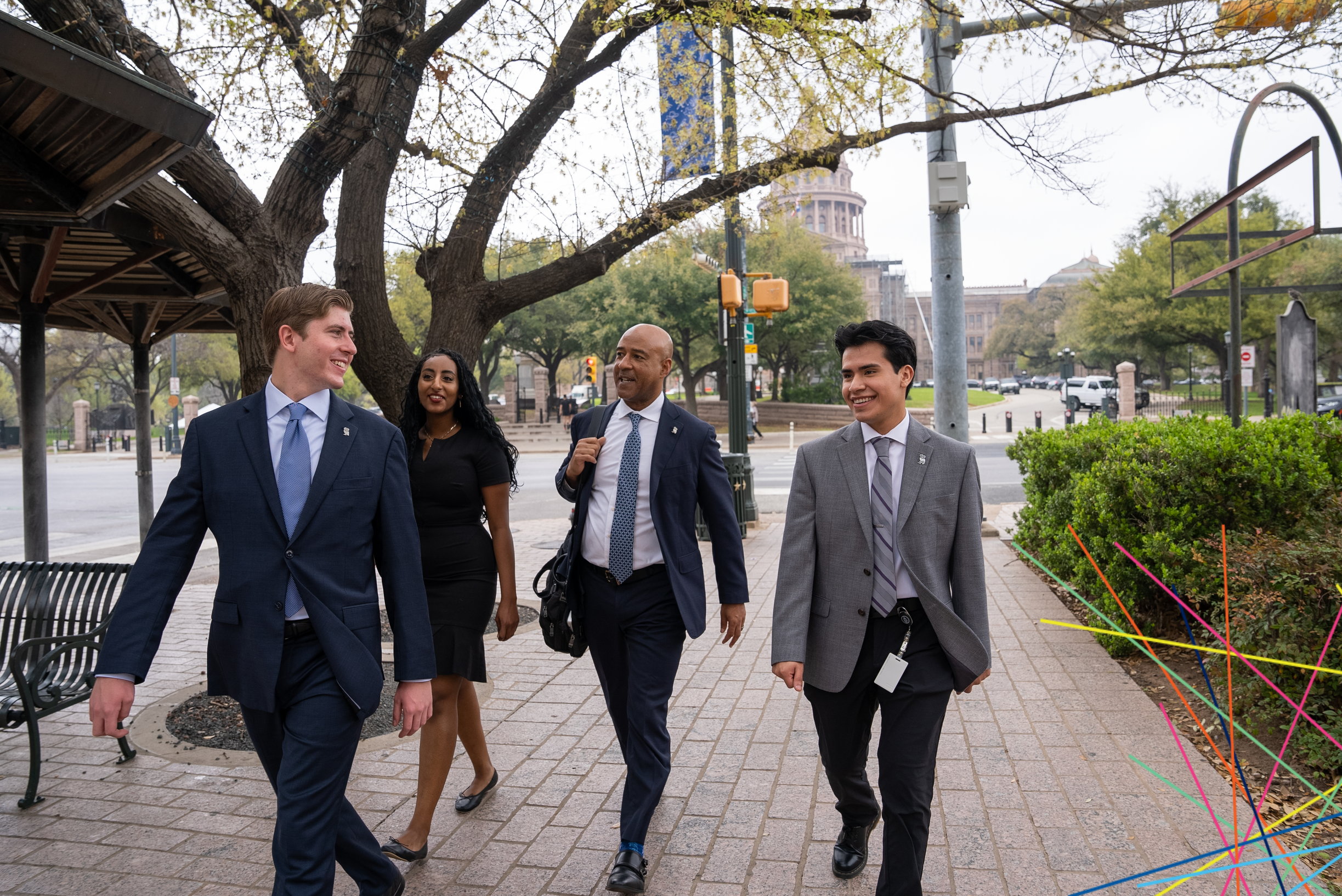 President Desroches walking with Gateway program students in Austin