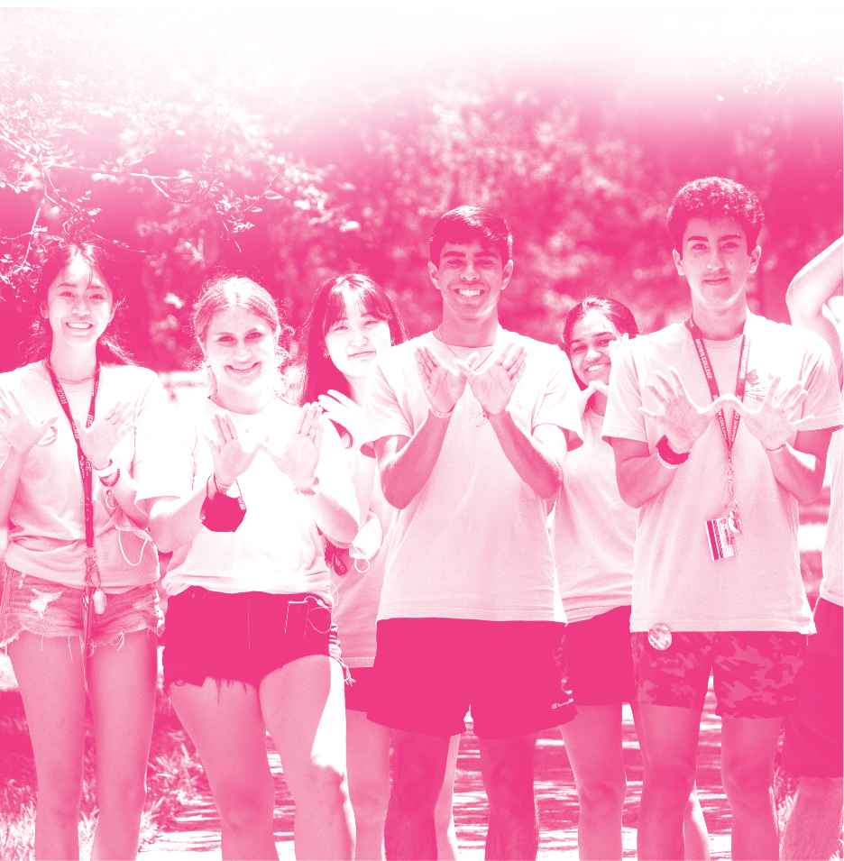 Students making the Owl sign